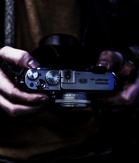 Wisconsin Private Detective Agency Surveillance and Reporting Man holding camera surveillance private detective agency